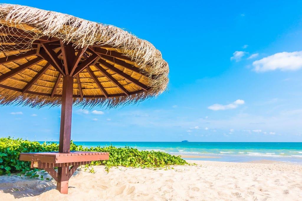 Zanzibar beach with thatched umbrella